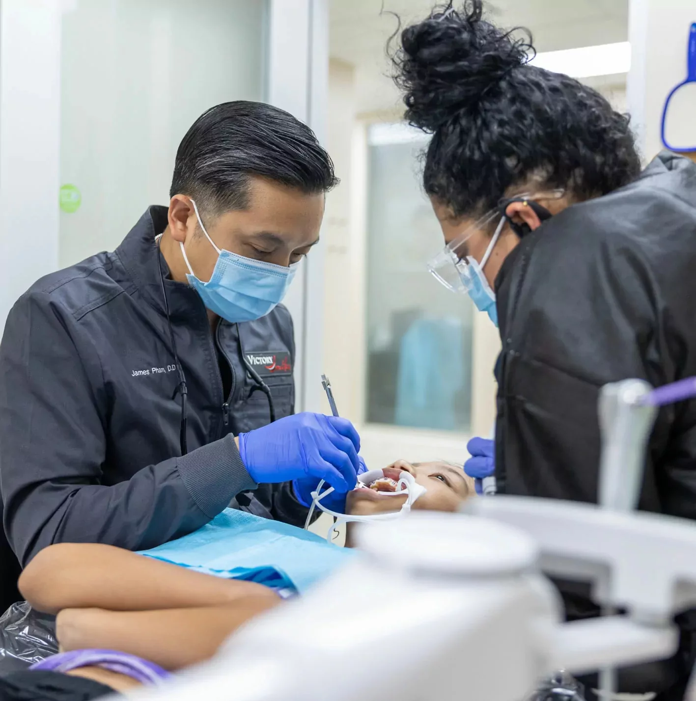 Patient Receiving Dental Treatment at Dental Office in Houston