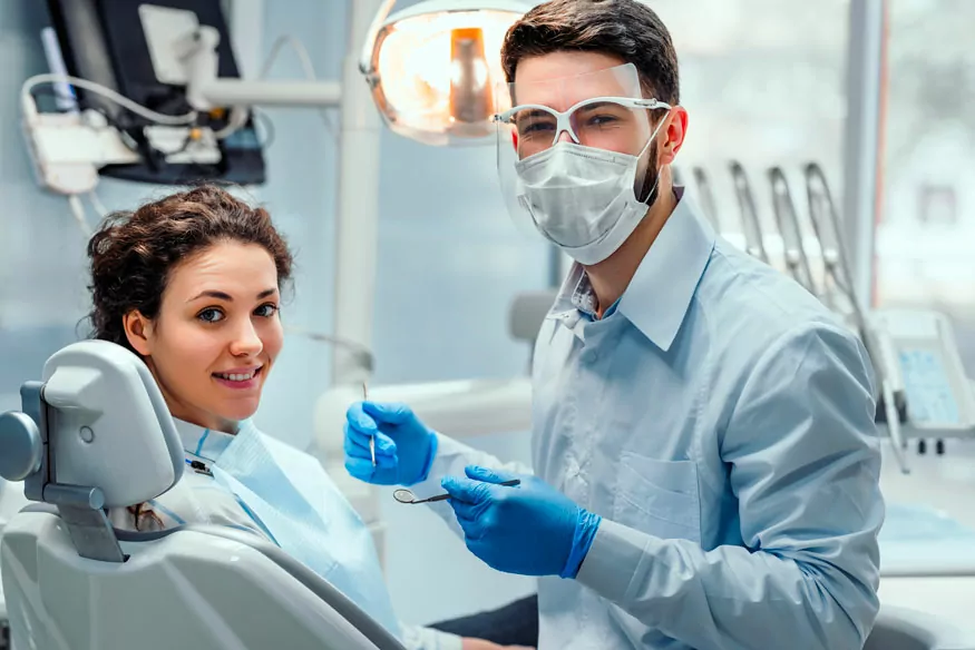 A Dentist Treating A Patient In Dental Clinic