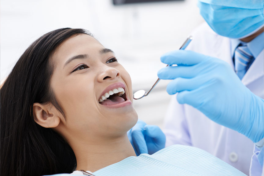 Woman Undergoing A Dental Check-up In Houston, TX