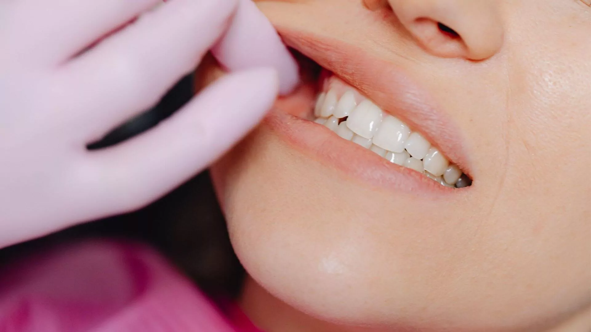 Dentist Examining Patient's Gums and Teeth